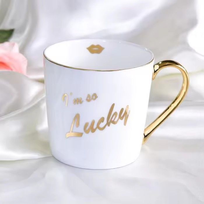 Wholesale gold handle ceramic mug white bone china christmas mug with logo