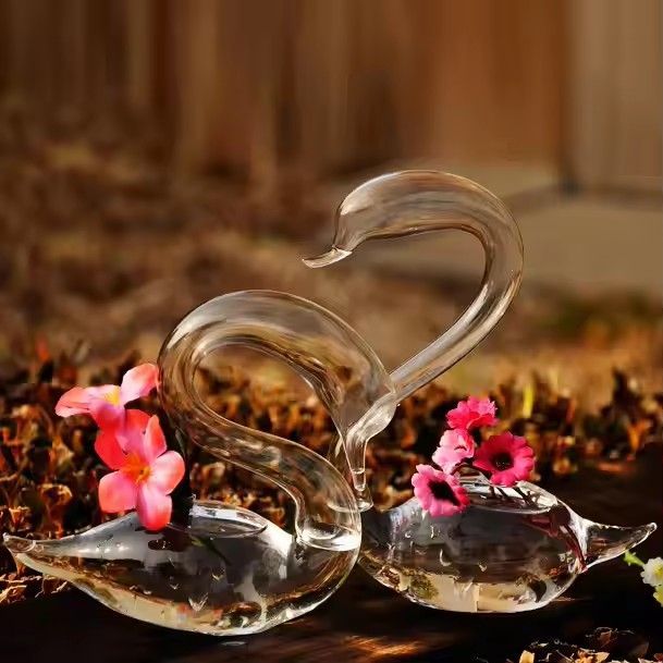 Swan shaped mouth blown glass vase for flower arrangements