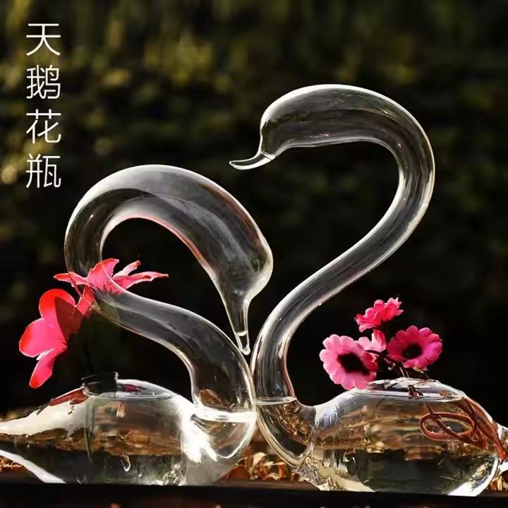 Swan shaped mouth blown glass vase for flower arrangements