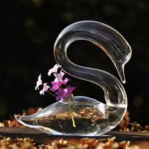 Swan shaped mouth blown glass vase for flower arrangements