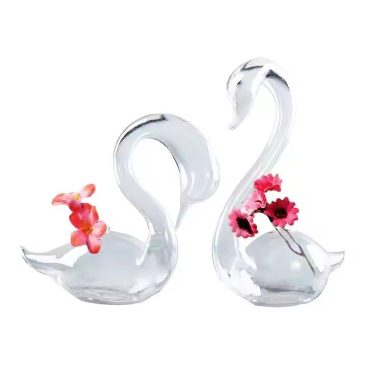 Swan shaped mouth blown glass vase for flower arrangements